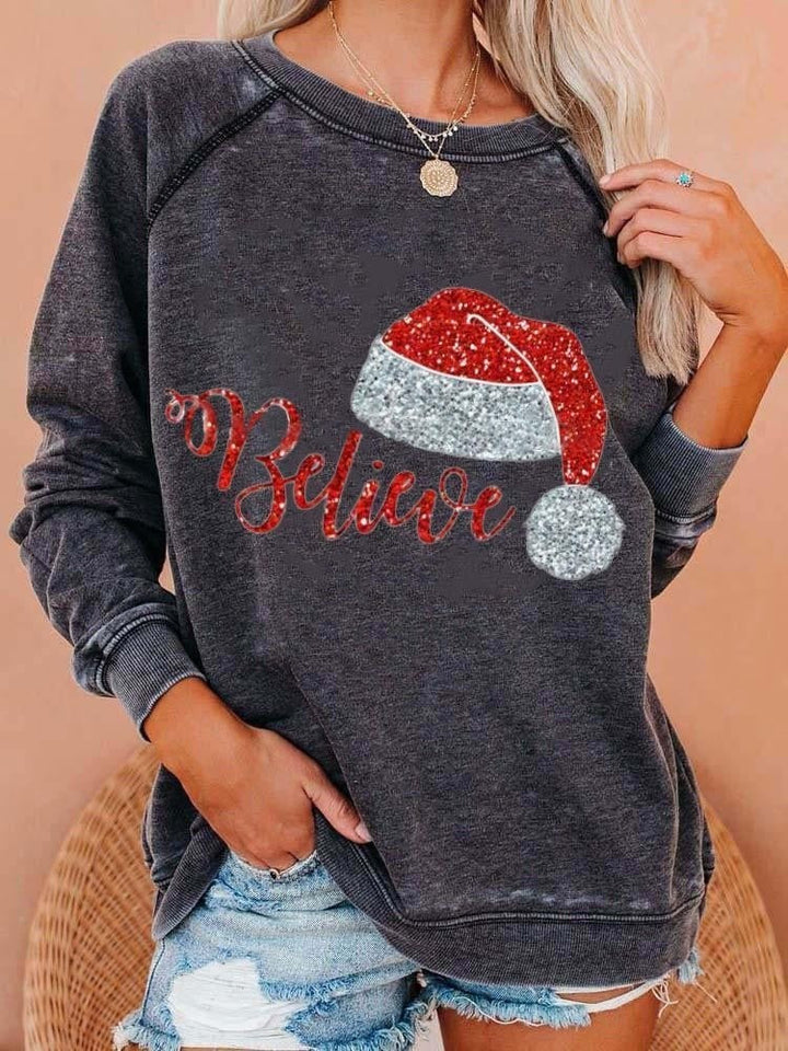 Festive Santa Hat Believe Sweatshirt – Women’s Christmas Pullover with Sparkling Holiday Graphic, Crew Neck, Long Sleeves, Cozy Winter Top